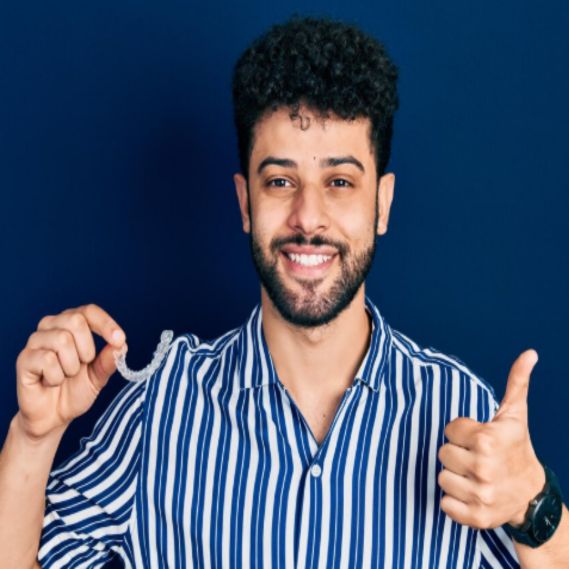 Patient smile with aligners